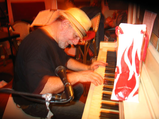 Norman burning up the piano